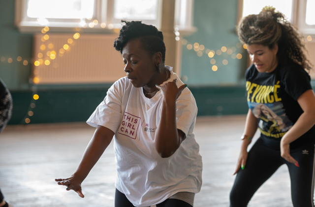 Two women dancing in an exercise class
