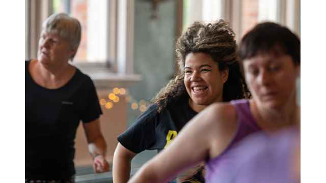 Girl smiling whilst dancing