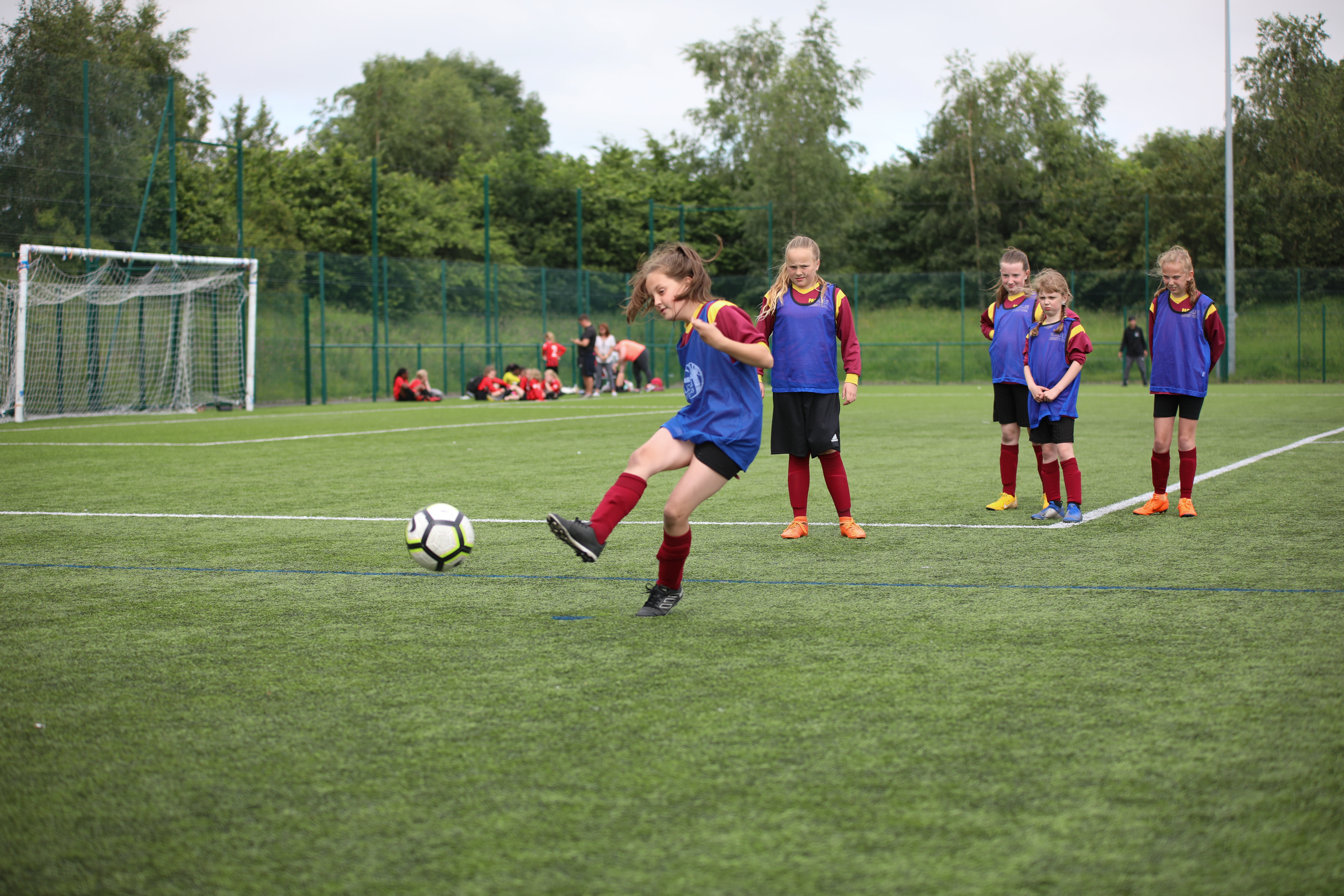 Group of young girls playing football